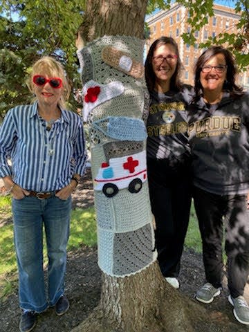 Kathy Strickler, Tara Babcock and Tammy Guerrettaz pose with the Tree 12 sweater, named Best All-Around.