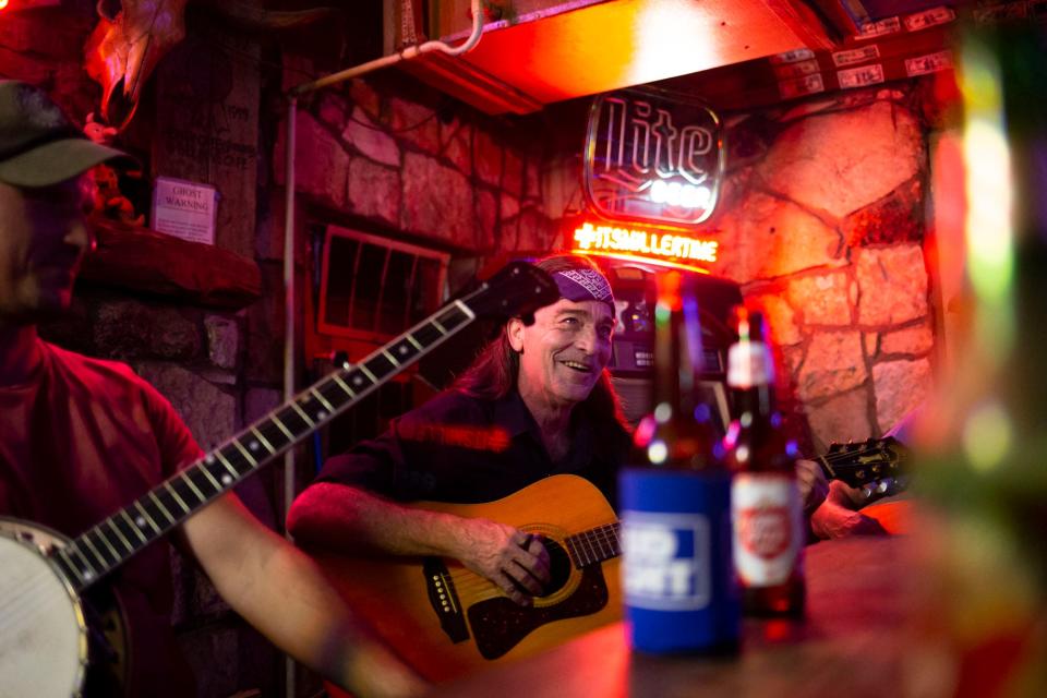 Jeff Johnson plays guitar during a weekly acoustic jam session he began years ago at the Devil's Backbone Tavern on Thursday, Aug. 9, 2018.