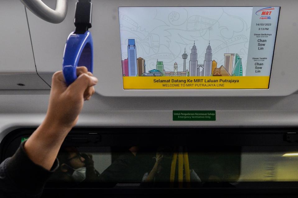 An electronic screen displaying an upcoming station is seen inside a train on the MRT Putrajaya Line during a media preview in Putrajaya March 14, 2023. — Picture by Miera Zulyana
