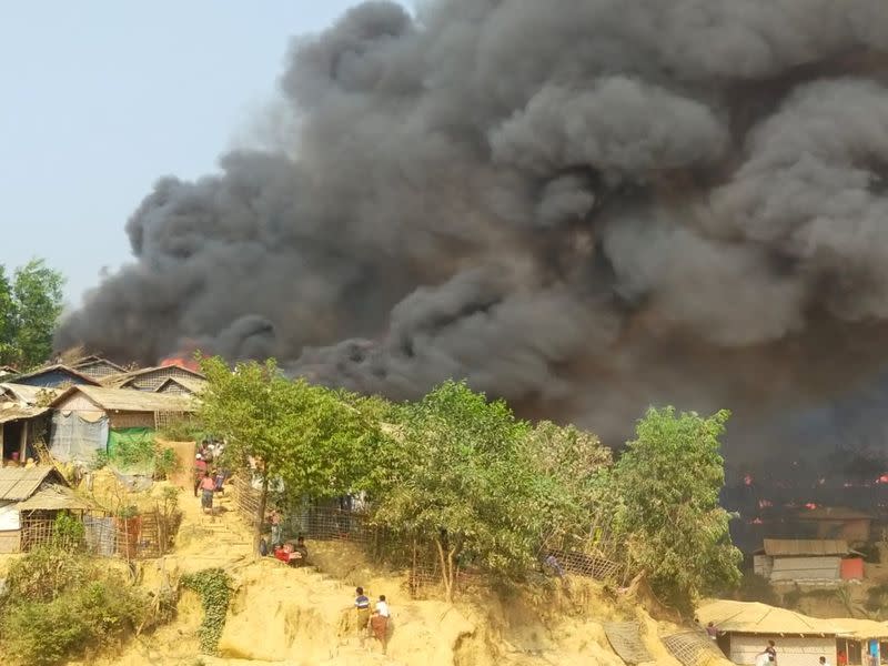 Smoke billows from a fire at a Balukhali refugee camp in Cox's Bazar