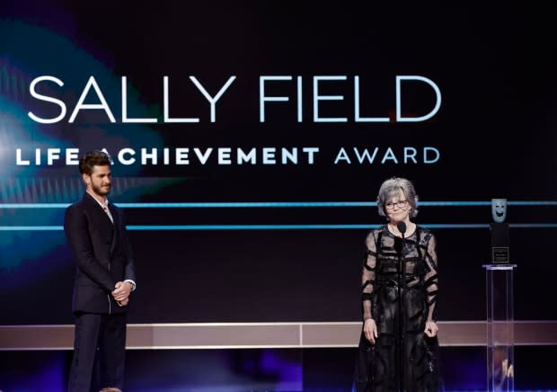 Andrew Garfield presents the SAG Life Achievement Award to honoree Sally Field onstage during the 29th Annual Screen Actors Guild Awards at Fairmont Century Plaza on Feb. 26, 2023, in Los Angeles.<p><a href="https://www.gettyimages.com/detail/1469868200" rel="nofollow noopener" target="_blank" data-ylk="slk:Kevin Winter/Getty Images;elm:context_link;itc:0;sec:content-canvas" class="link ">Kevin Winter/Getty Images</a></p>