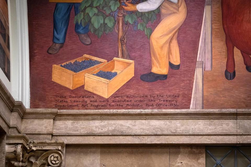 An inscription on a fresco describes the New Deal era art commission at the El Viejo Building, the former downtown Post Office, in Modesto, Calif., on Friday, July 22, 2022.