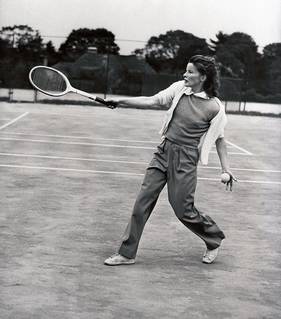 <p>Katharine Hepburn demonstrates her follow-through, as she hits the tennis court at Merion Cricket Club in 1940. </p>