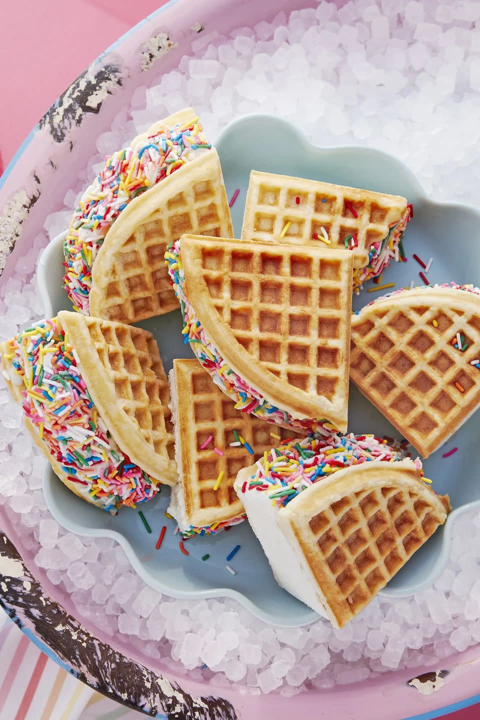 rainbow waffle sandwiches in a tray on pebble ice to keep cool