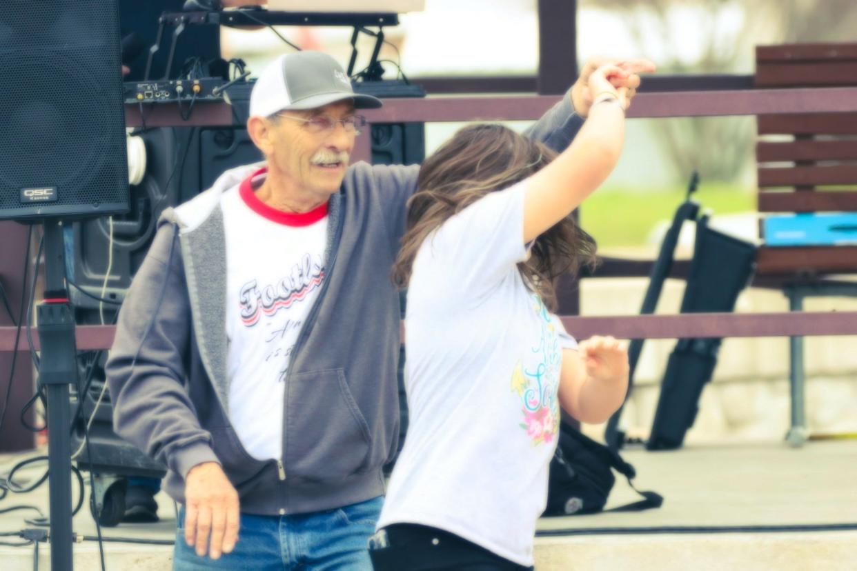 People dance in the streets of Elmore City during the 2021 Footloose Festival. The annual event celebrates the small Oklahoma town's ties to the popular 1984 movie "Footloose," which was released 40 years ago this year.