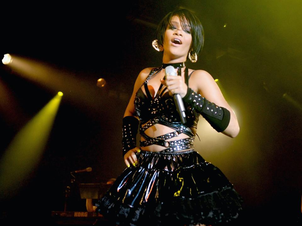Rihanna performs onstage wearing black leather outfit in 2007
