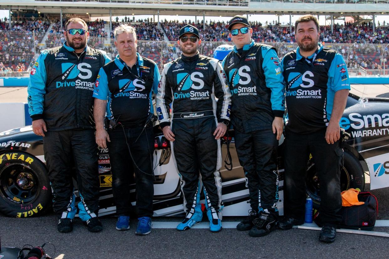 Dee-Mack resident Alex Timmerman (on left) with NASCAR Xfinity Series driver Kyle Weatherman (middle) and the DGM Racing crew.