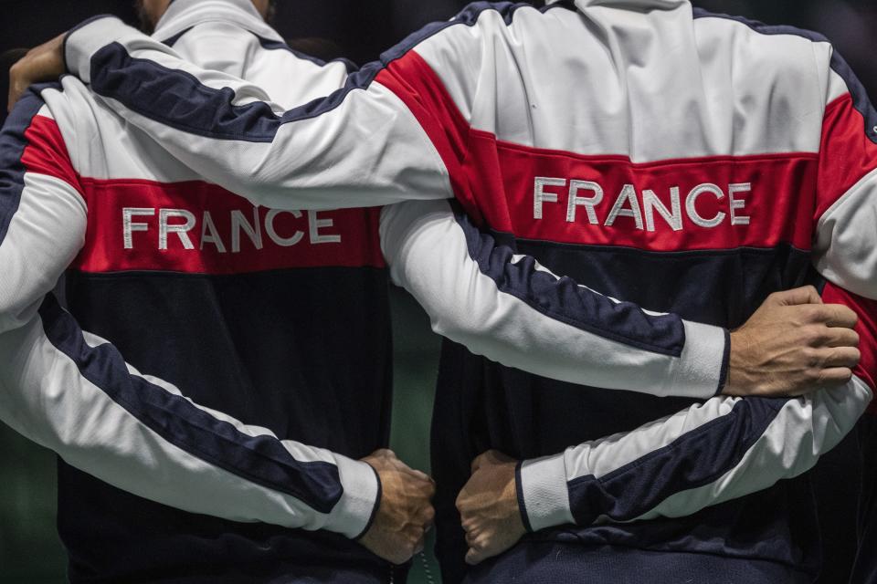 France players stand during the national anthem before the Davis Cup tennis match between Jo-Wilfried Tsonga and Serbia's Filip Krajinovic in Madrid, Spain, Thursday, Nov. 21, 2019. (AP Photo/Bernat Armangue)