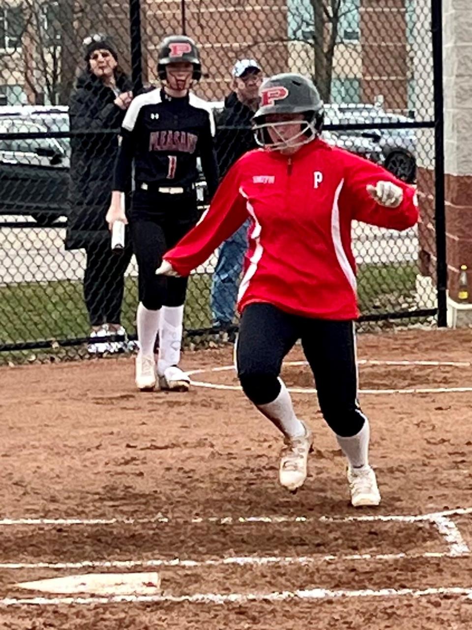 Pleasant's Sydney Smith scores a run during a softball game at home against Shelby last season.