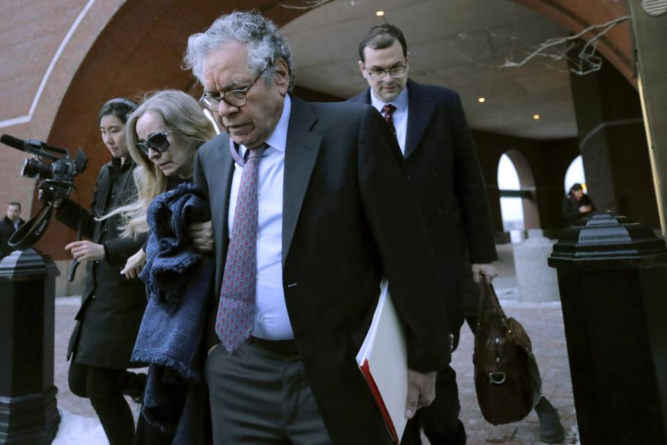 Insys Therapeutics founder John Kapoor, front, departs federal court Thursday, Jan. 23, 2020, in Boston, after he was sentenced to 5 1/2 years in prison for orchestrating a bribery and kickback scheme prosecutors said helped fuel the opioid crisis. He was found guilty the previous May of racketeering and conspiracy in a scheme where millions of dollars in bribes were paid to doctors across the United States to prescribe the company's highly addictive oral fentanyl spray, known as Subsys. (AP Photo/Charles Krupa)