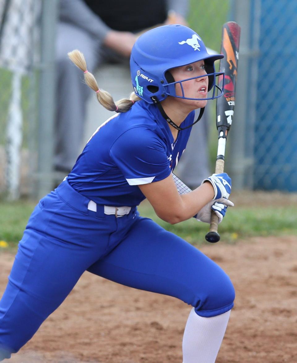 Madeline McBride of Tuslaw watches the flight of the ball as she drives in a run during their game against Perry at Tuslaw on Friday, April 22, 2022.