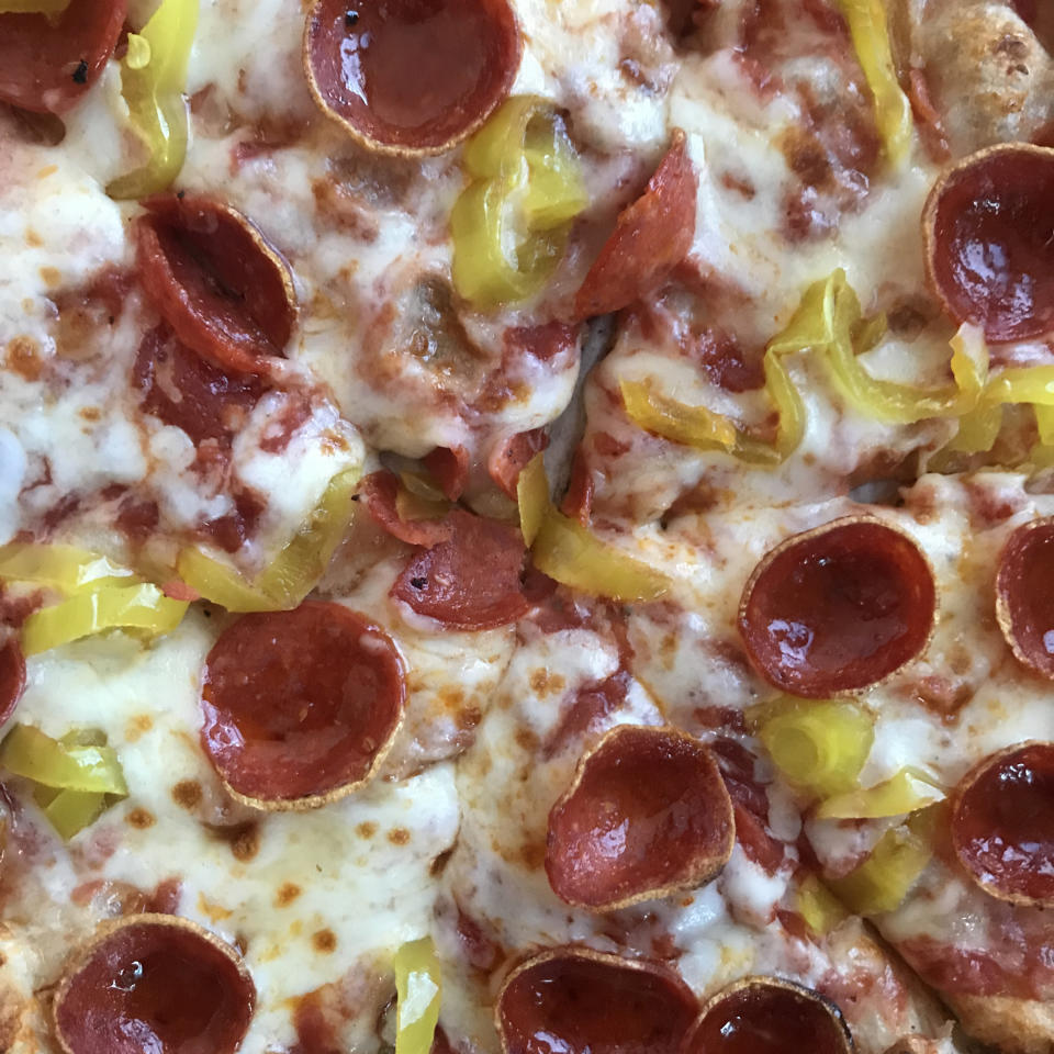 Pepperoni pizza with banana peppers.