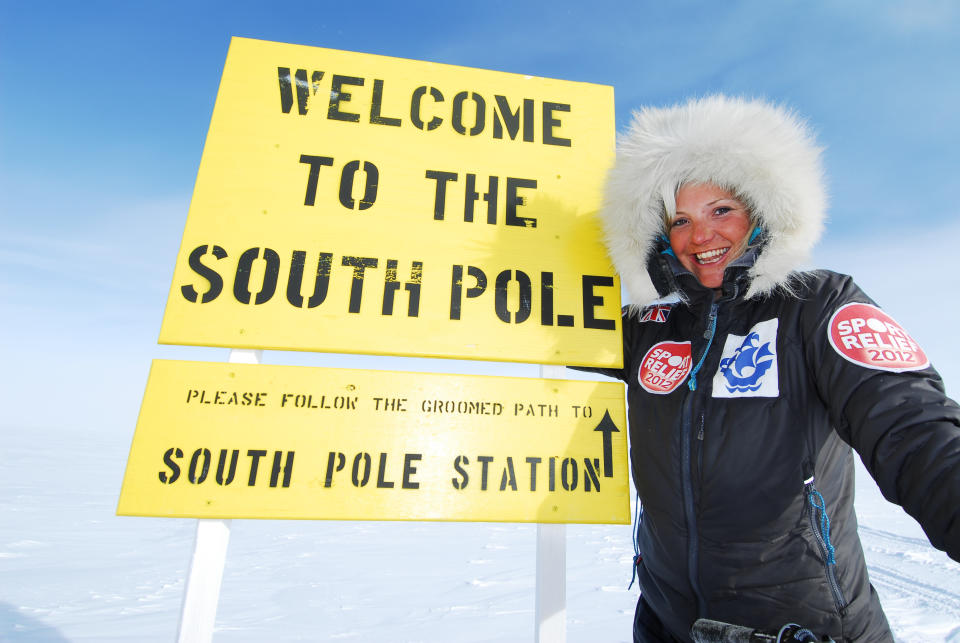 Helen Skelton proudly poses in front of the 'Welcome to the south pole' sign as she completes her challenge to travel 500 miles across Antartica for sport relief 2012 in the South Pole, Antartica.