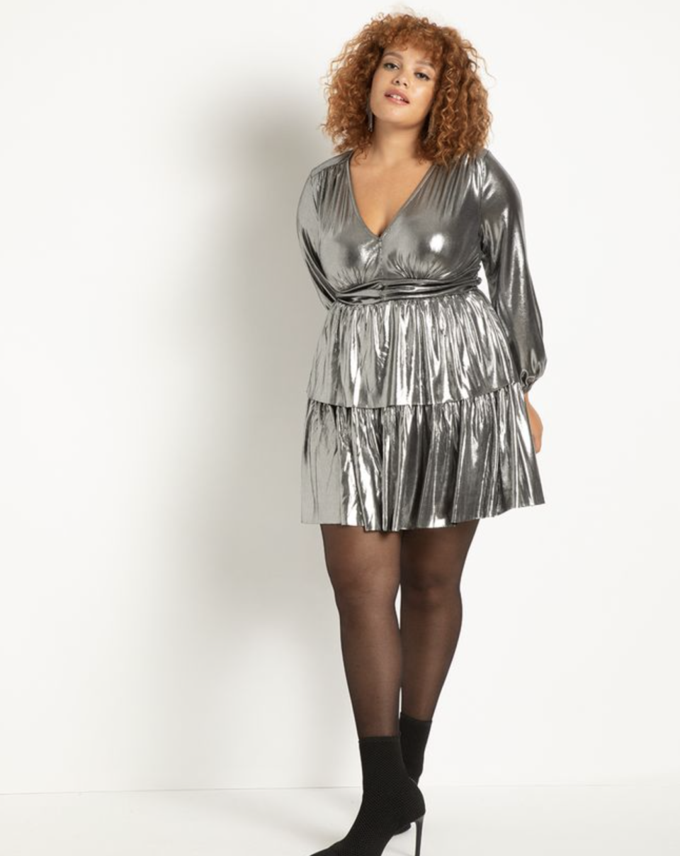 plus size model wearing silver Tiered Skirt Lurex Mini Dress and black heeled boots