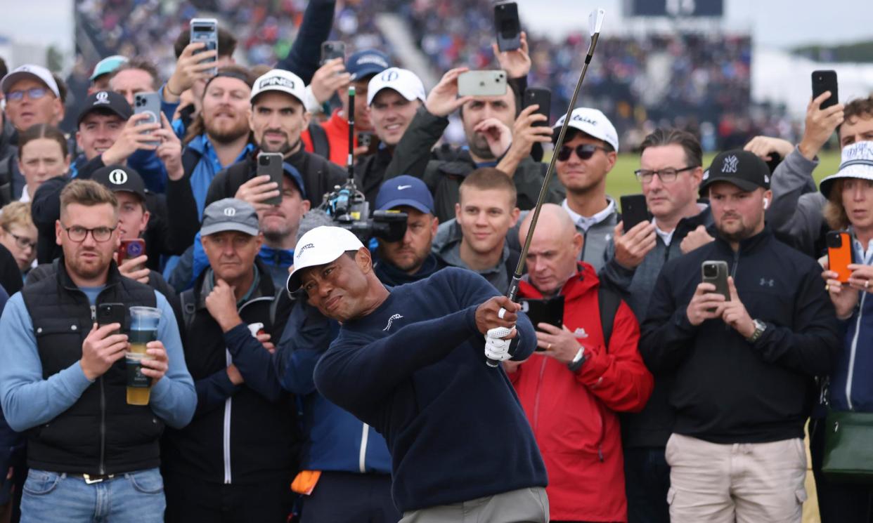 <span>Large galleries followed Tiger Woods during his bogey-riddled second round at Troon.</span><span>Photograph: Peter Morrison/AP</span>