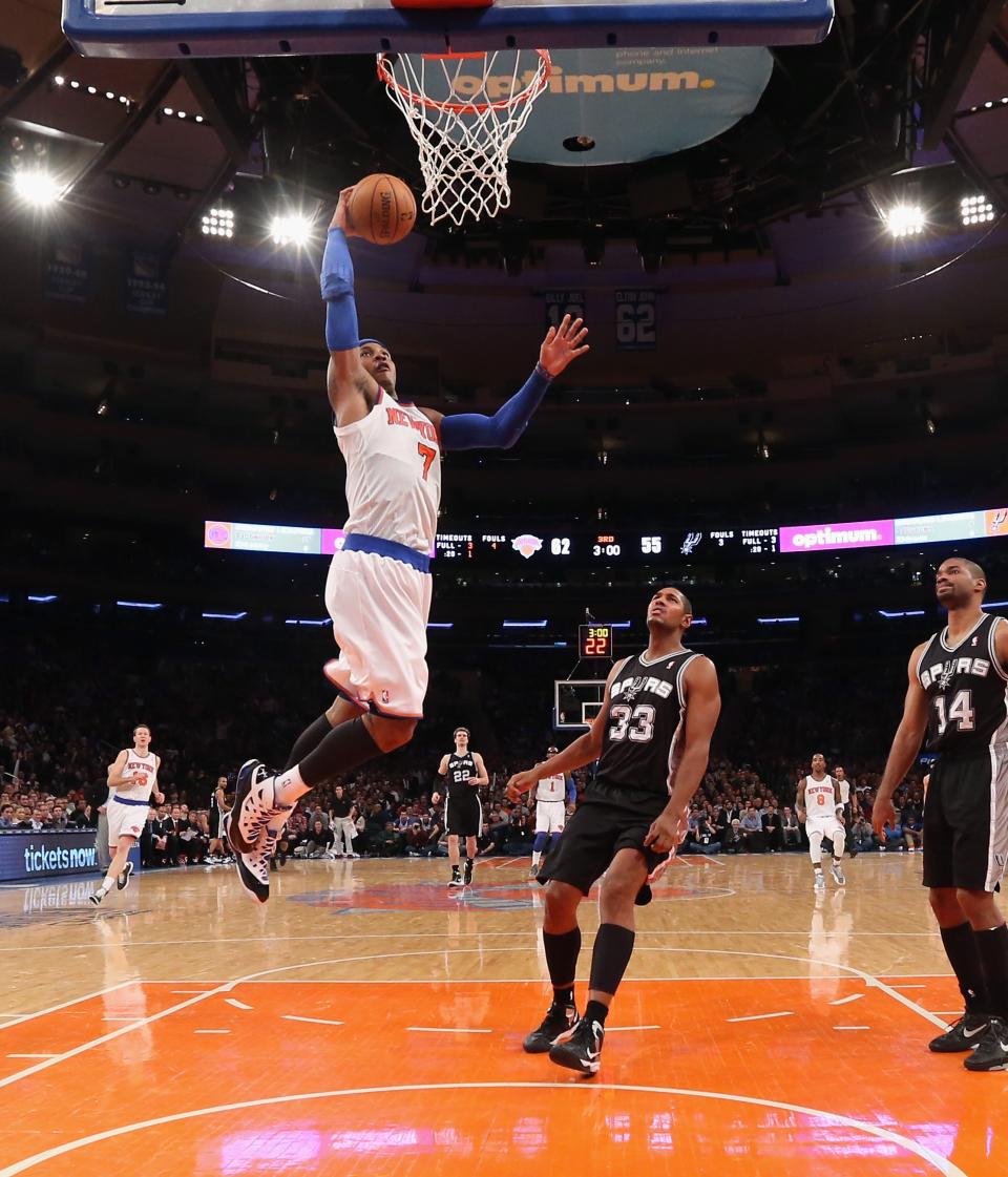 NEW YORK, NY - JANUARY 03: Carmelo Anthony #7 of the New York Knicks scores two against the San Antonio Spurs at Madison Square Garden on January 3, 2013 in New York City. NOTE TO USER: User expressly acknowledges and agrees that, by downloading and/or using this photograph, user is consenting to the terms and conditions of the Getty Images License Agreement. The Knicks defeated the Spurs 100-83. (Photo by Bruce Bennett/Getty Images)