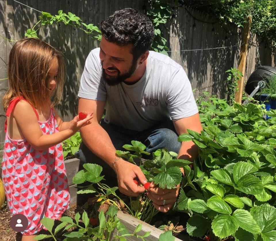 Dave Chalek, planting strawberries with his niece, Vivienne Chalek-Tomasetti