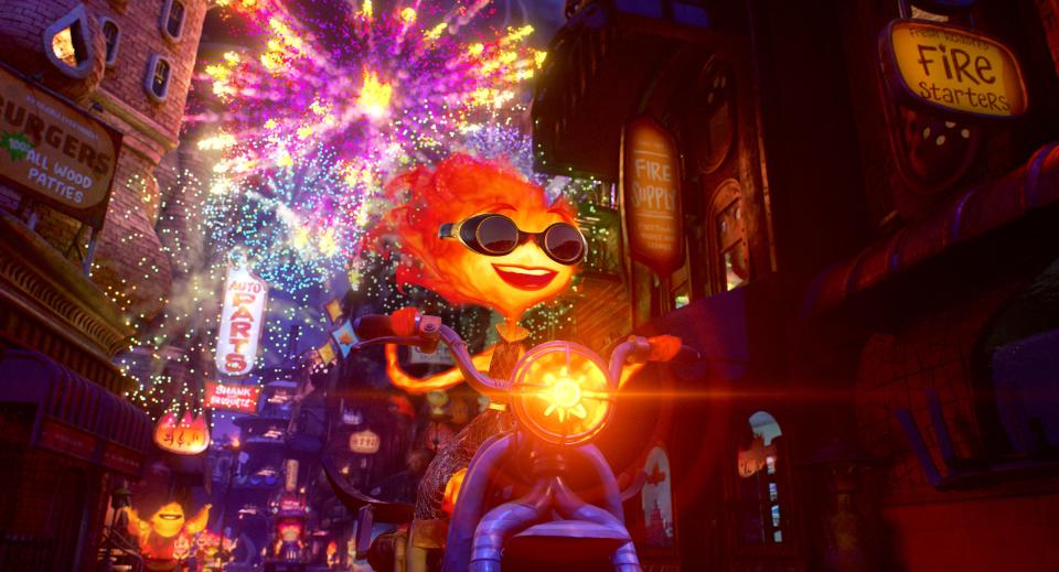 Fiery young woman Ember (voiced by Leah Lewis) lives with her immigrant parents in Firetown, a borough of Element City, in the Pixar animated romantic comedy "Elemental."