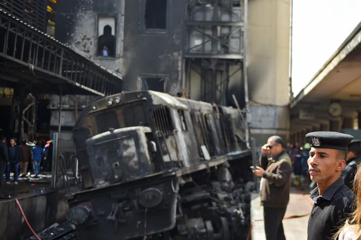 Members of the security forces and onlookers gather at the scene of the crash. (MOHAMED EL-SHAHED/AFP/Getty Images)