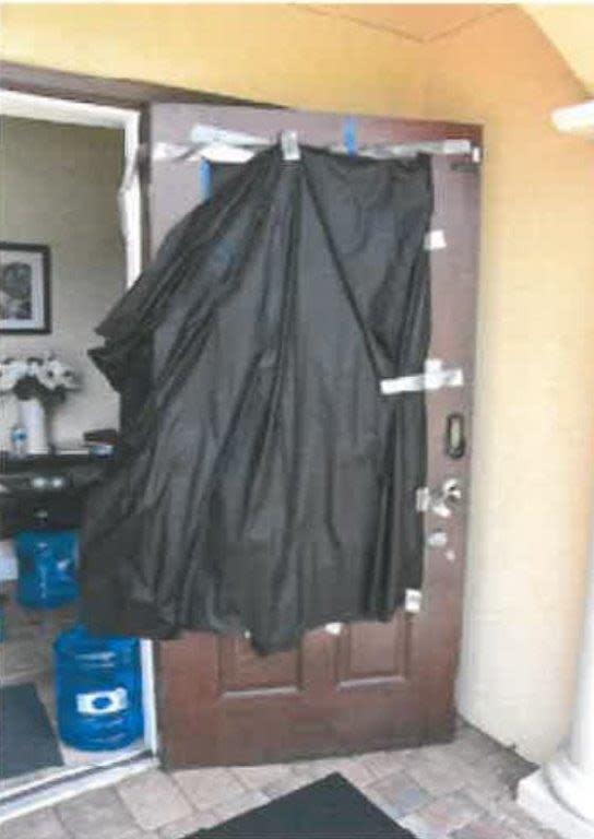 Black plastic tablecloth over the door at the suburban Boca Raton home of Tzvi Aswang where he raped and tortured his therapist in 2022.