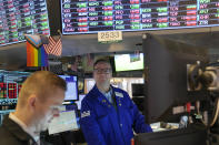 Traders work on the floor at the New York Stock Exchange in New York, Monday, Nov. 28, 2022. (AP Photo/Seth Wenig)