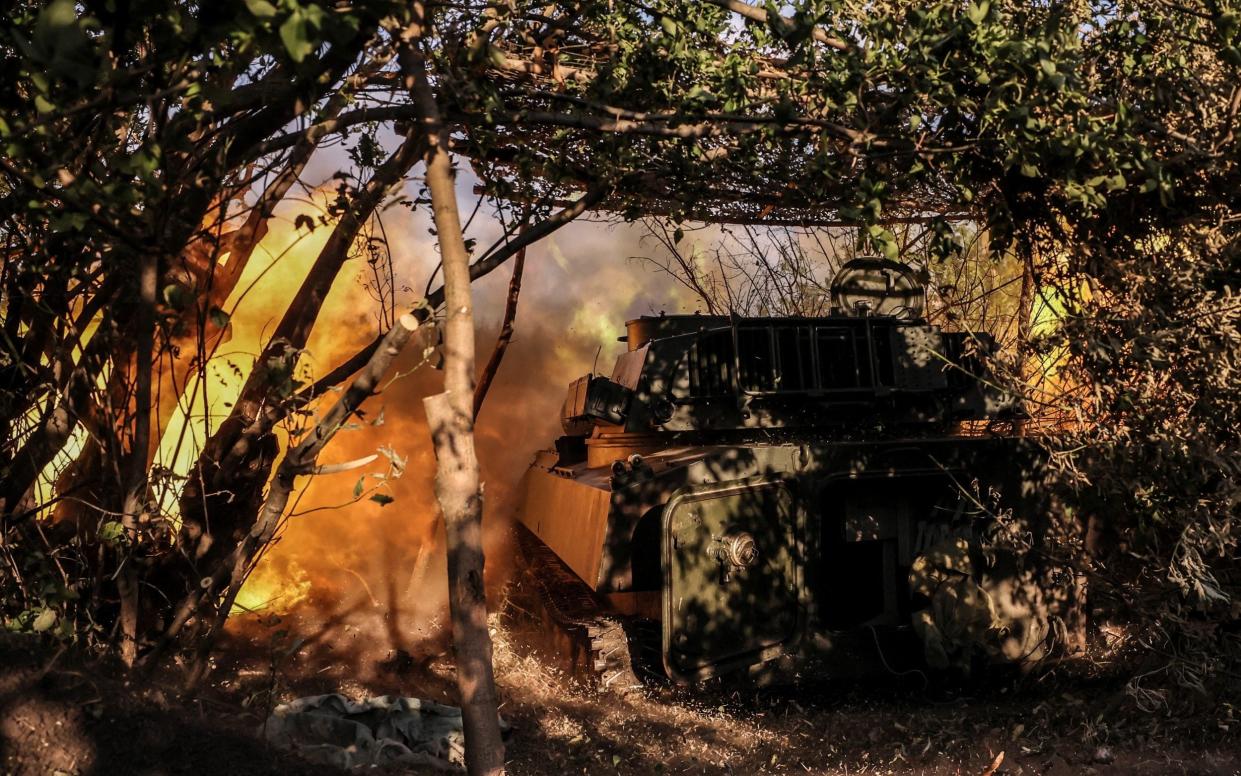 Ukrainian servicemen of 24th Mechanized Brigade fire a howitzer towards Russian troops on a front line near to Chasiv Yar