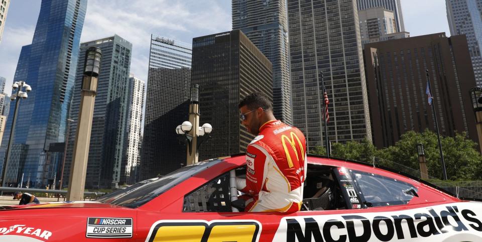 chicago, illinois july 19 bubba wallace gets into his car before driving around downtown chicago in promotion of the nascar chicago street race announcement on july 19, 2022 in chicago, illinois photo by patrick mcdermottgetty images