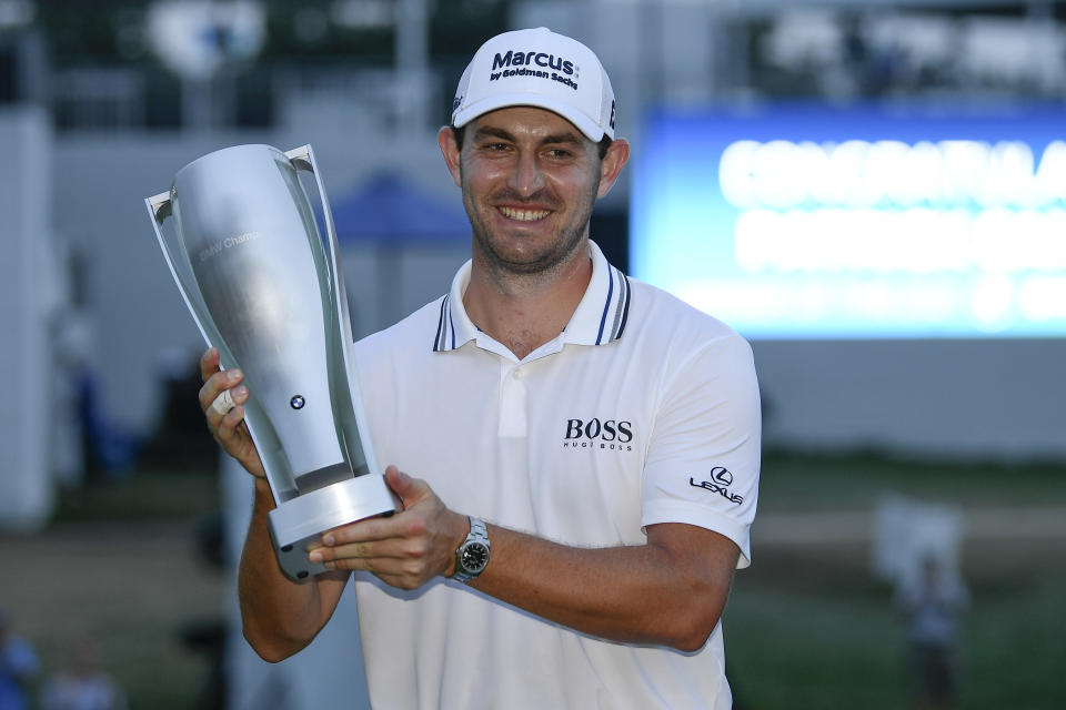 Patrick Cantlay holds the trophy after winning the BMW Championship golf tournament, Sunday, Aug. 29, 2021, at Caves Valley Golf Club in Owings Mills, Md. (AP Photo/Nick Wass)