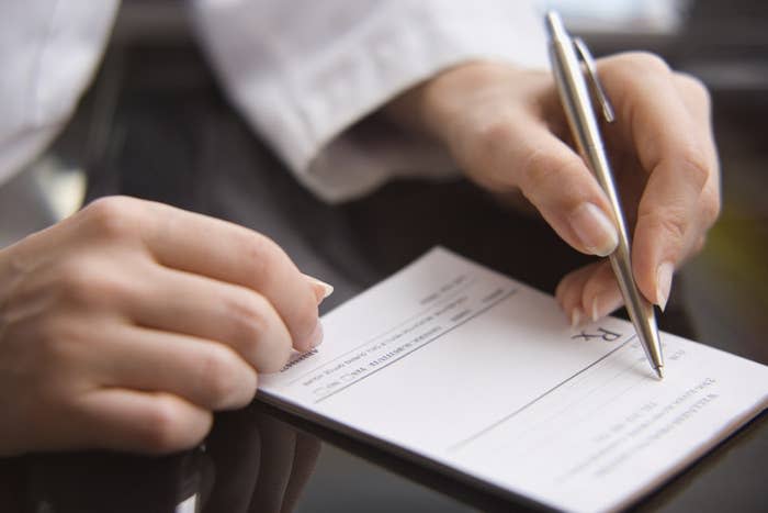 A doctor writing a prescription