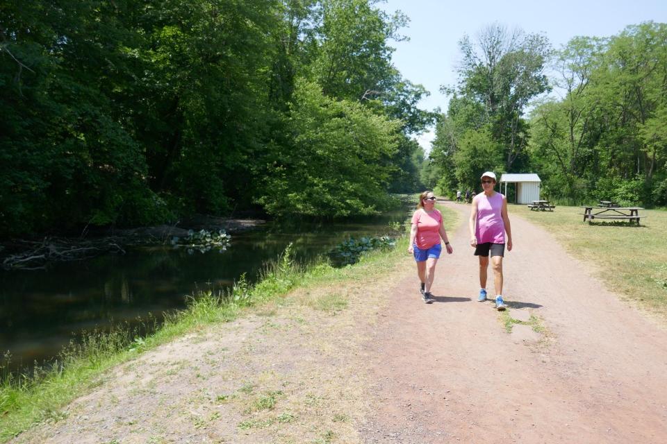 Nancy Doyle (left) and Kathy Kraeck, both of Lower Makefield, walk along the Delaware Canal in Lower Makefield Friday, as the Bucks County Water and Sewer Authority issued a water conservation advisory because of low streamflow conditions due to "abnormally dry" weather.