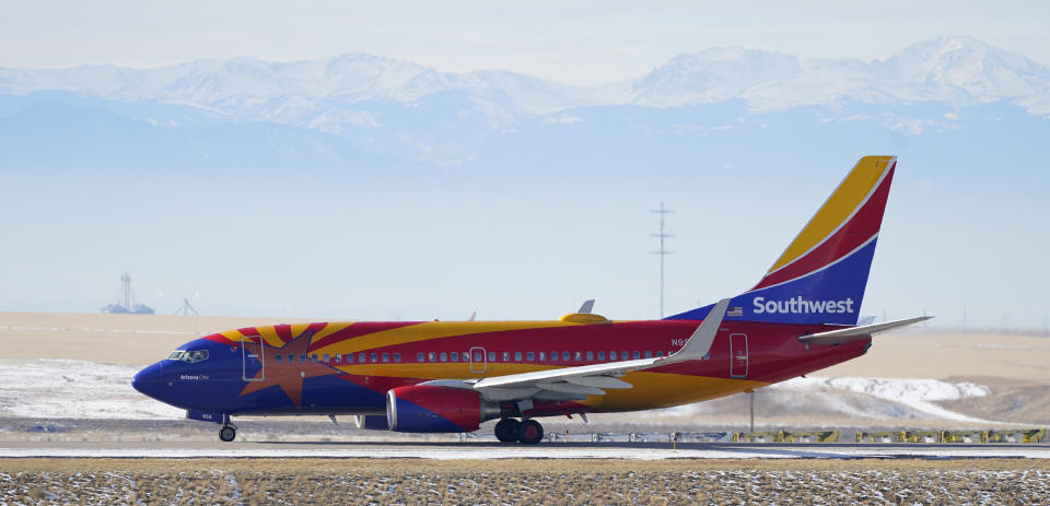 FILE - In this Dec. 31, 2020 file photo, a Southwest Airlines jetliner taxis down a runway for takeoff from Denver International Airport in Denver. Southwest said Thursday, Jan. 28, 2021, that it lost $3.1 billion last year, its first full-year loss since 1972. (AP Photo/David Zalubowski, File)
