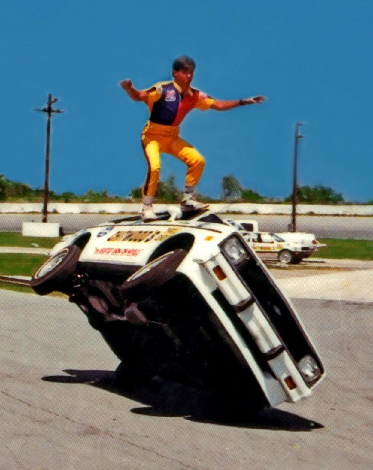 Joie Chitwood does his famous wing walk atop a moving car during one of the family's auto stunt shows.