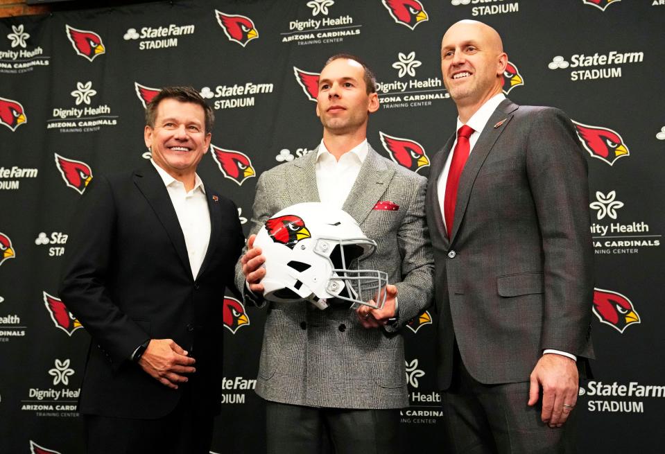 Jonathan Gannon is introduced as the new head coach of the Arizona Cardinals by team president Michael Bidwill and general manager Monti Ossenfort (right) during a news conference at the Cardinals training facility in Tempe on Feb. 16, 2023.