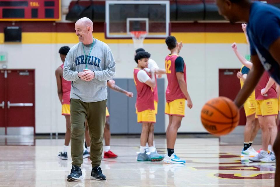 Coach Andrew Jones smiles during the men’s basketball practice on Wednesday at Sacramento City College.