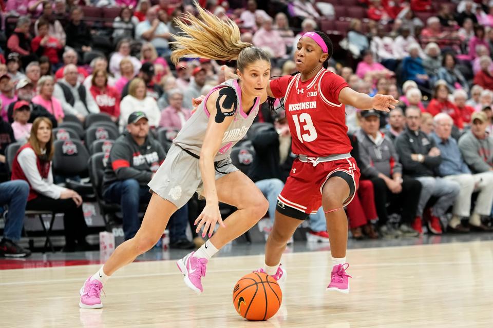 Feb 1, 2024; Columbus, OH, USA; Ohio State Buckeyes guard Jacy Sheldon (4) dribbles past Wisconsin Badgers guard Ronnie Porter (13) during the first half of the NCAA women’s basketball game at Value City Arena.