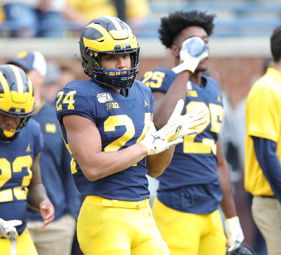 Michigan Wolverines running back Zach Charbonnet warms up before action against the Iowa Hawkeyes on Saturday, Oct. 5, 2019, at Michigan Stadium in Ann Arbor.