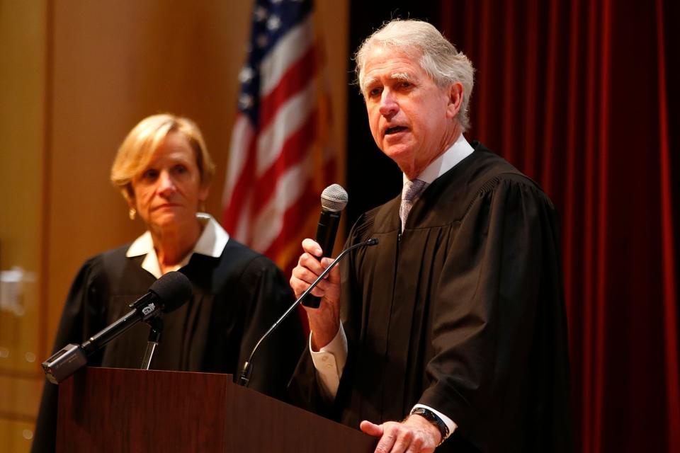 Chief Justice Mark Green and his wife, retired Associate Justice Karen Green, speak with Keith Middle School students on how the judicial system works, as part of Judicial Outreach Month.