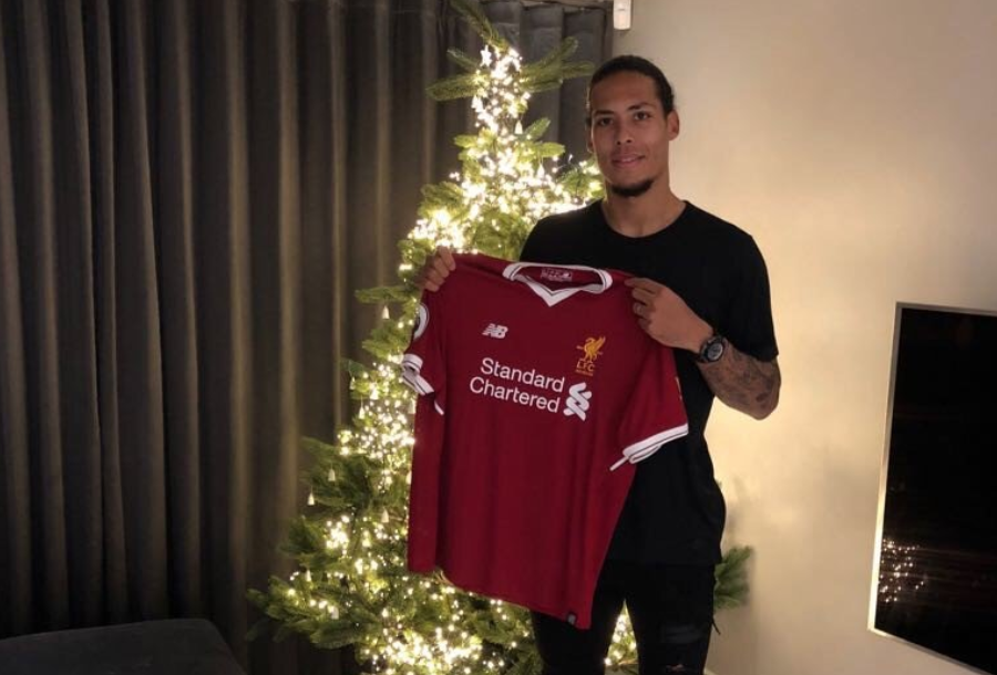 Virgil Van Dijk poses with a Liverpool shirt. (Photo: Liverpool Football Club)