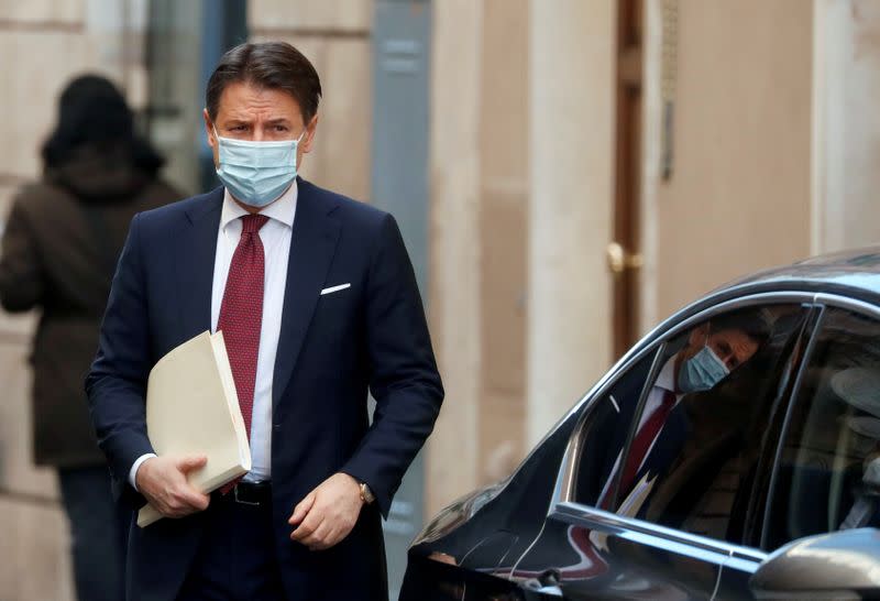 FILE PHOTO: Italy's caretaker Prime Minister Giuseppe Conte leaves his house