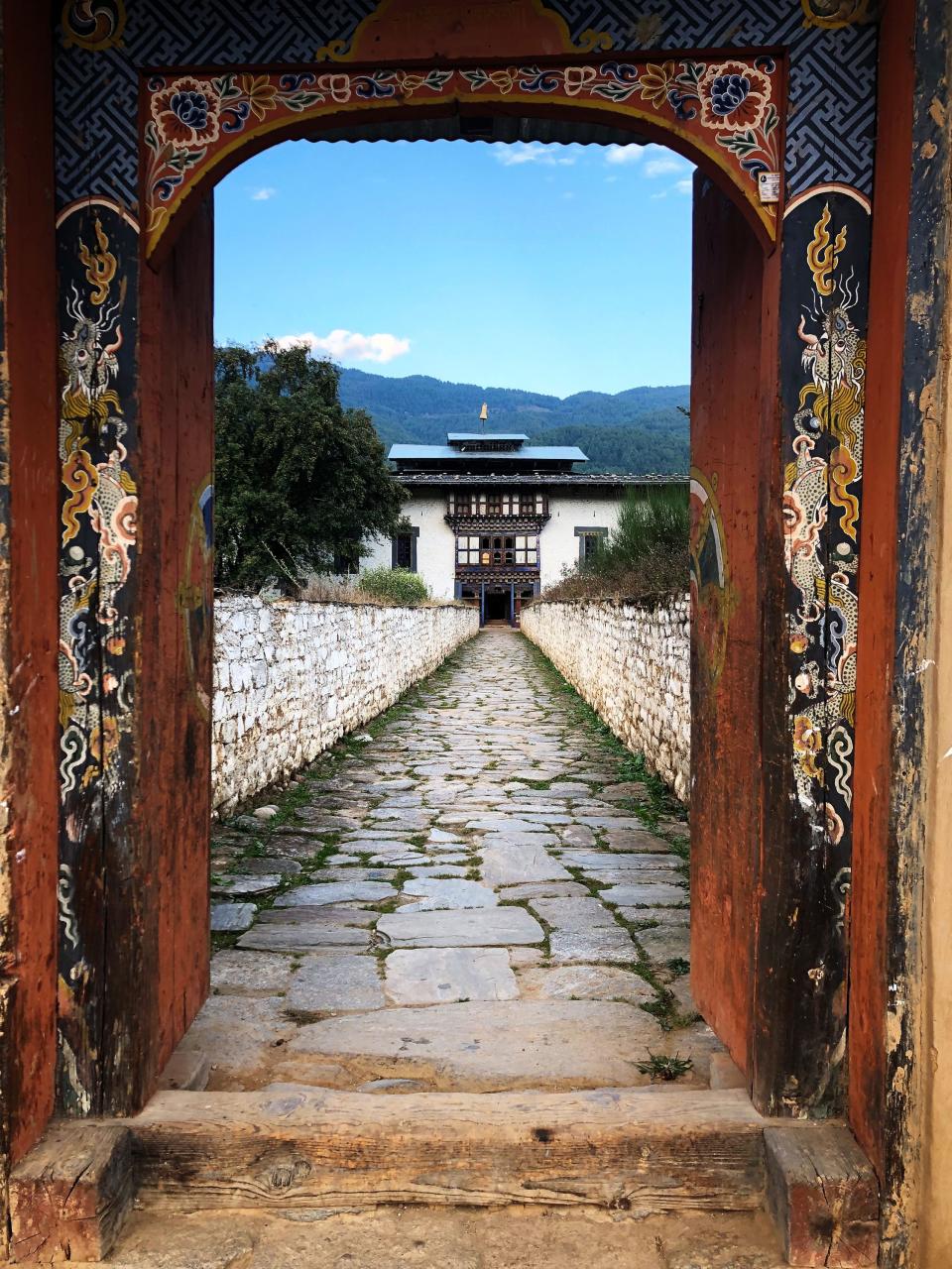 The west side of the palace, where the entrance was moved after modern highways were built in Bhutan. The entrance will be restored to its original location on the palace's north side.