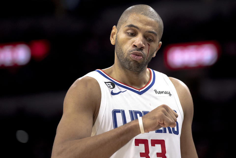 Los Angeles Clippers forward Nicolas Batum (33) bleeds after taking an elbow to the face during the second half of the team's NBA basketball game against the San Antonio Spurs, Friday, Nov. 4, 2022, in San Antonio. (AP Photo/Nick Wagner)