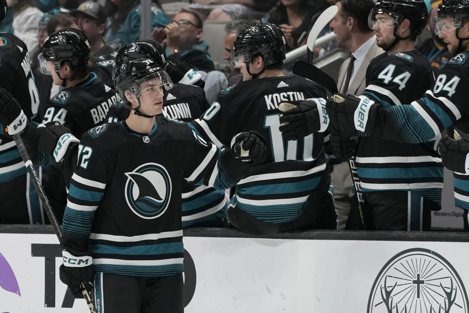 San Jose Sharks left wing William Eklund (72) is congratulated for his goal against the Dallas Stars during the second period of an NHL hockey game in San Jose, Calif., Tuesday, March 26, 2024. (AP Photo/Jeff Chiu)