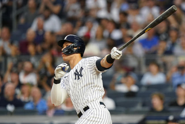 New York Yankees Aaron Judge, wearing jersey number 42 on Jackie Robinson  Day, watches his fly ball to the wall during the first inning of a Major  League baseball game against the