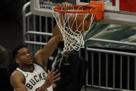 Milwaukee Bucks' Giannis Antetokounmpo dunks during the first half of an NBA basketball game against the Minnesota TimberwolvesTuesday, Feb. 23, 2021, in Milwaukee. (AP Photo/Morry Gash)