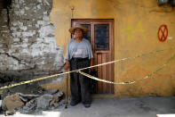 <p>Luis Garcia, 79, a bricklayer, poses for a portrait outside a house that he built, after an earthquake in Jojutla de Juarez, Mexico, September 30, 2017. The sign reads, “HA” which means habitable. “No house that I built was damaged by the earthquake,” Garcia said. (Photo: Edgard Garrido/Reuters) </p>