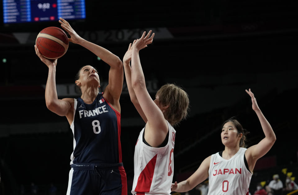 France's Helena Ciak (8), left, shoots over Japan's Maki Takada (8) during women's basketball preliminary round game at the 2020 Summer Olympics, Tuesday, July 27, 2021, in Saitama, Japan. (AP Photo/Eric Gay)