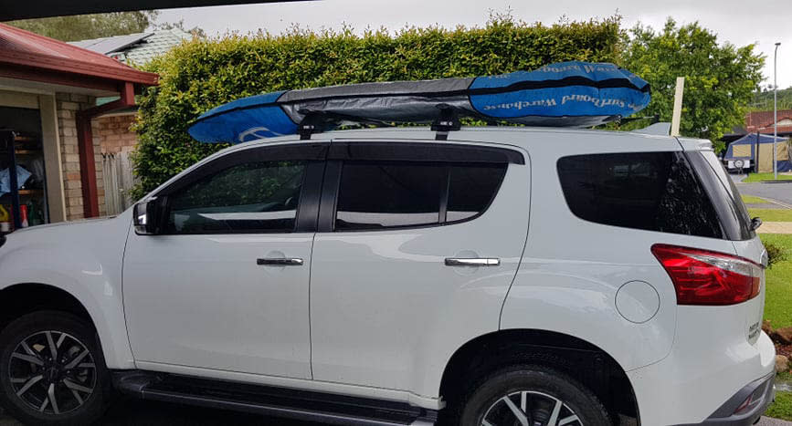 A supplied photo of Brian Springfield's car with his surfboard strapped to the roof. Source: Supplied 