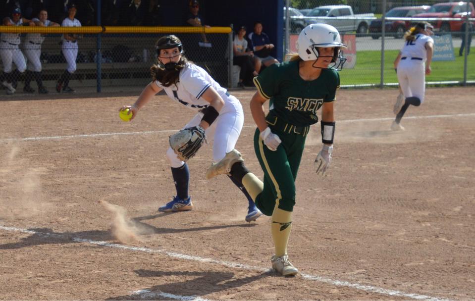 Airport first baseman Alayna McDaniel throws out Callie Cousino of St. Mary Catholic on a bunt attempt. during a 4-1 Airport victory on Monday, May 6, 2024.