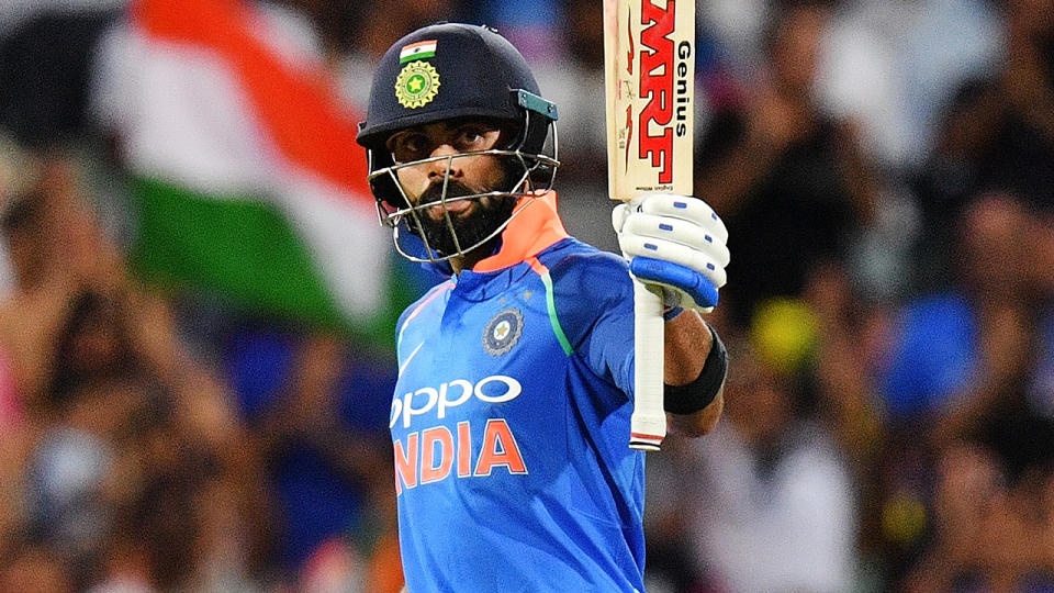 Virat Kohli celebrates his century. (Photo by Daniel Kalisz/Getty Images)