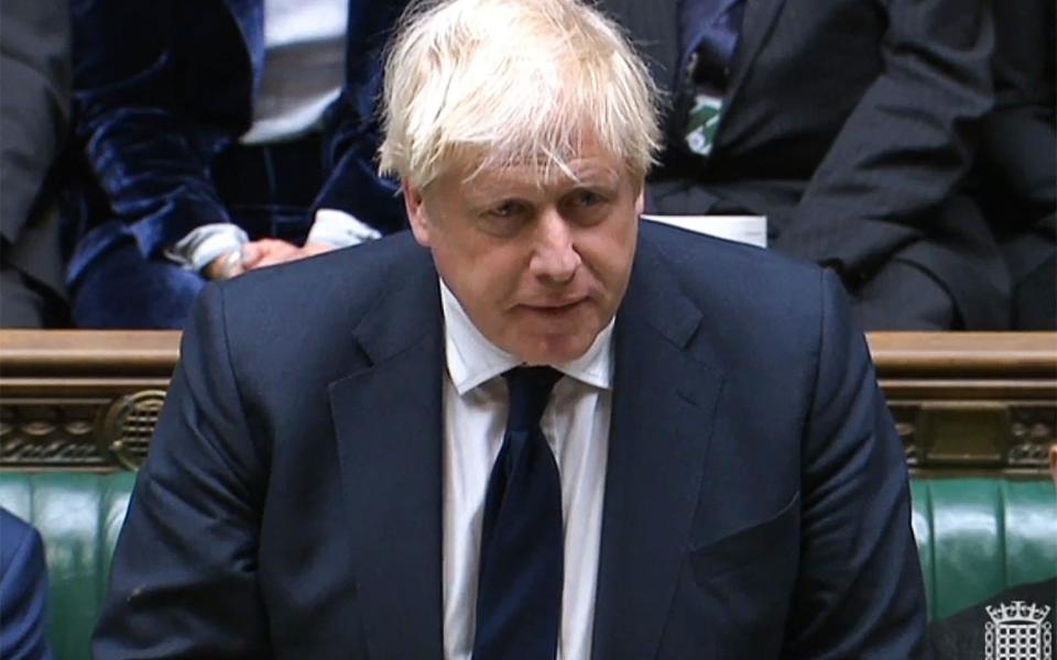 A video grab from footage broadcast by the UK Parliament's Parliamentary Recording Unit (PRU) shows British Prime Minister Boris Johnson addressing the House of Commons  - Handout/AFP